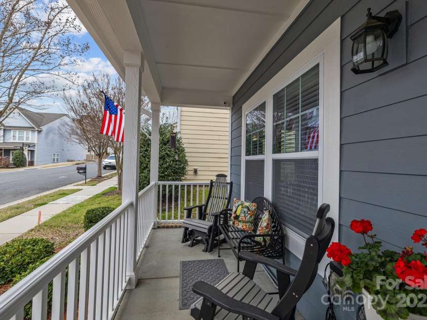 12545 Druids Glen Drive, Pineville, NC 28134.  MLS# CAR4234518, YatesRealty ID 4552. Inviting front porch to sit & enjoy a cold beverage