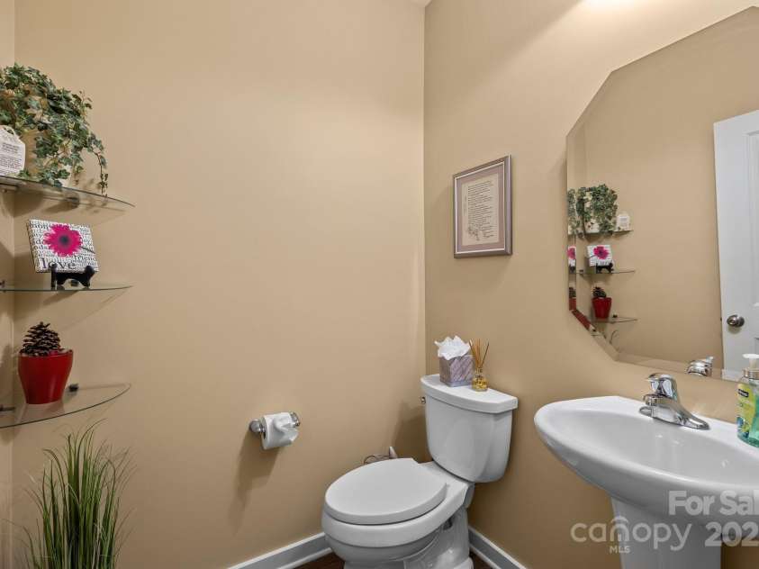 12545 Druids Glen Drive, Pineville, NC 28134.  MLS# CAR4234518, YatesRealty ID 4552. Powder room downstairs