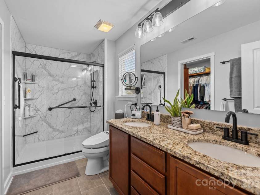 12545 Druids Glen Drive, Pineville, NC 28134.  MLS# CAR4234518, YatesRealty ID 4552. Primary bathroom with walk-in shower
