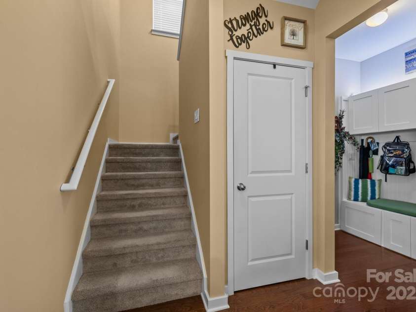 12545 Druids Glen Drive, Pineville, NC 28134.  MLS# CAR4234518, YatesRealty ID 4552. Staircase is split with landing in between