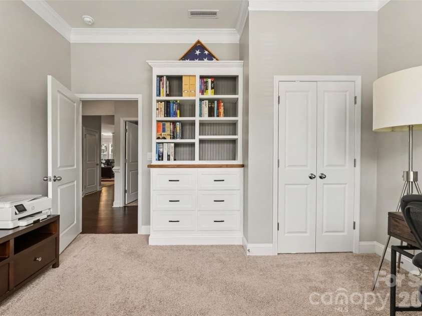 676 Latrobe Drive, Iron Station, NC 28080.  MLS# CAR4401657, YatesRealty ID 45521. Custom Built ins in Bedroom 2