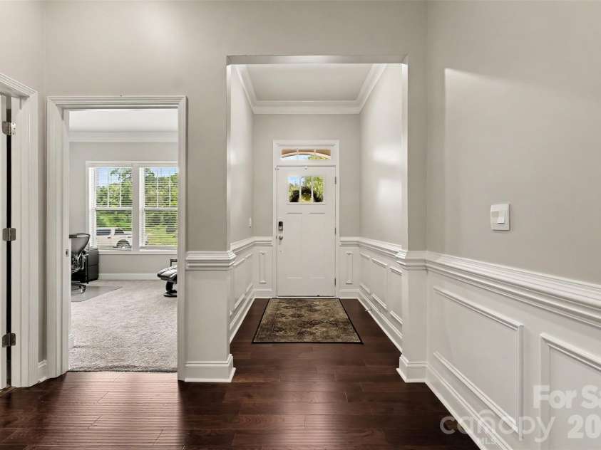 676 Latrobe Drive, Iron Station, NC 28080.  MLS# CAR4401657, YatesRealty ID 45521. Entryway featuring elegant wainscoting