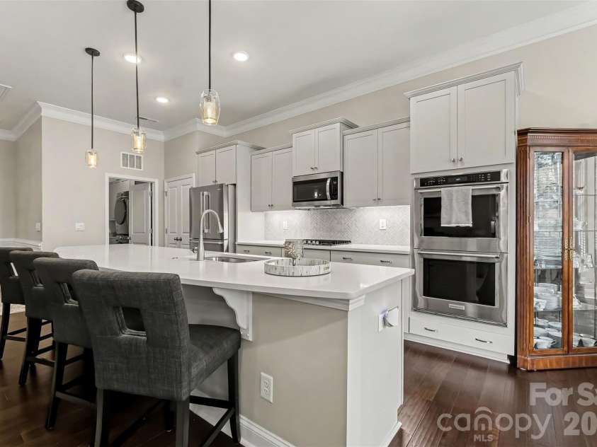 676 Latrobe Drive, Iron Station, NC 28080.  MLS# CAR4401657, YatesRealty ID 45521. Large quartz Island perfect for casual dining or entertaining.  Kitchen also offers a double oven for everyday cooking or entertaining.