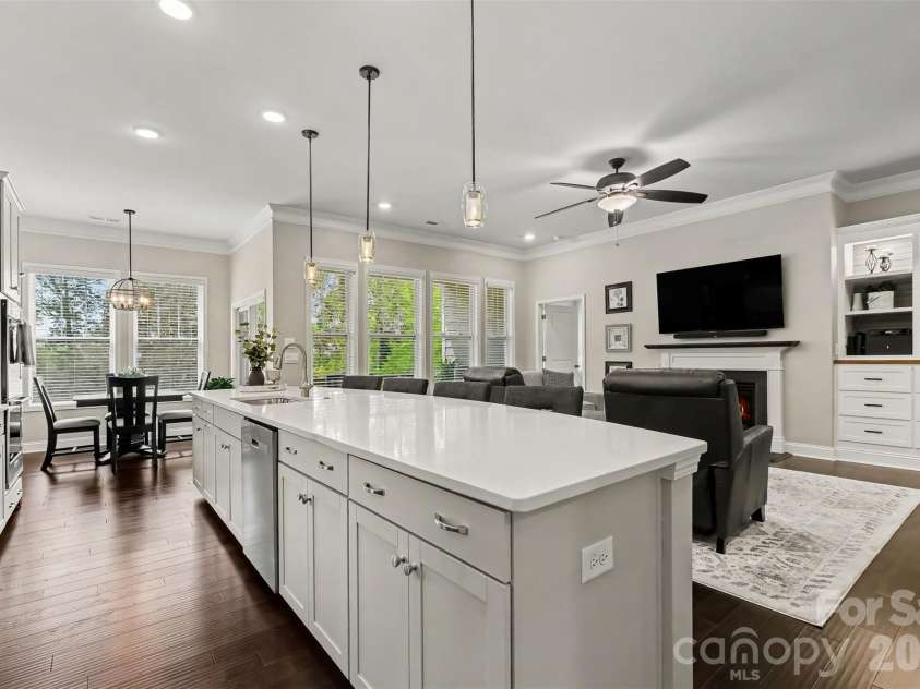 676 Latrobe Drive, Iron Station, NC 28080.  MLS# CAR4401657, YatesRealty ID 45521. Spacious kitchen Island featuring stylish pendant lighting and abundant storage, creating the perfect focal point for cooking, gathering and entertaining