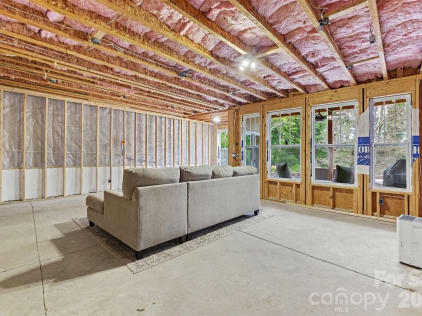 676 Latrobe Drive, Iron Station, NC 28080.  MLS# CAR4401657, YatesRealty ID 45521. Unfinished walk-out basement offering abundant potential for future living space, recreation, storage.