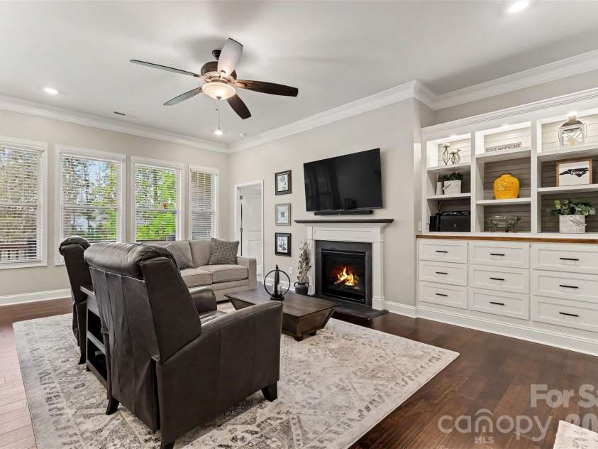 676 Latrobe Drive, Iron Station, NC 28080.  MLS# CAR4401657, YatesRealty ID 45521. Warm and inviting great room featuring copy atmosphere