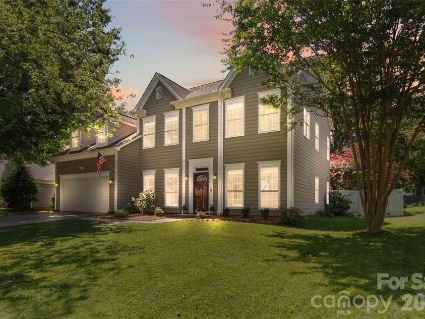 8914 Raven Park Drive, Charlotte, NC 28216.  MLS# CAR4413312, YatesRealty ID 45529. Twilight with lights on