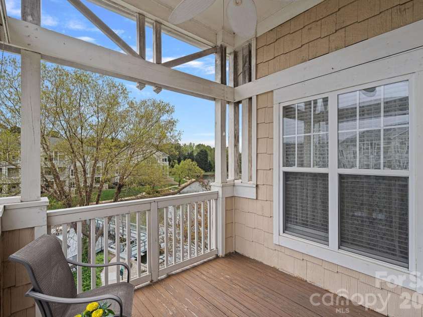18742 Nautical Drive, Cornelius, NC 28031.  MLS# CAR4343939, YatesRealty ID 4553. Balcony overlooking pool and community pond