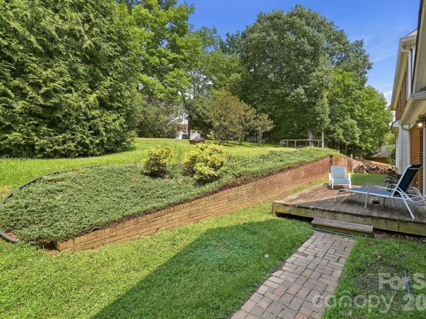 201 Wainsley Place, Matthews, NC 28105.  MLS# CAR4407896, YatesRealty ID 45535. Back Yard, Deck