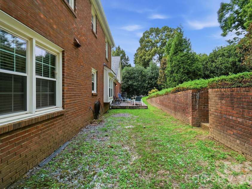 201 Wainsley Place, Matthews, NC 28105.  MLS# CAR4407896, YatesRealty ID 45535. Backyard, Deck and  Back Exterior