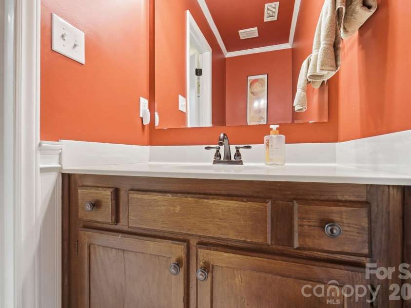 201 Wainsley Place, Matthews, NC 28105.  MLS# CAR4407896, YatesRealty ID 45535. Downstairs Half Bathroom