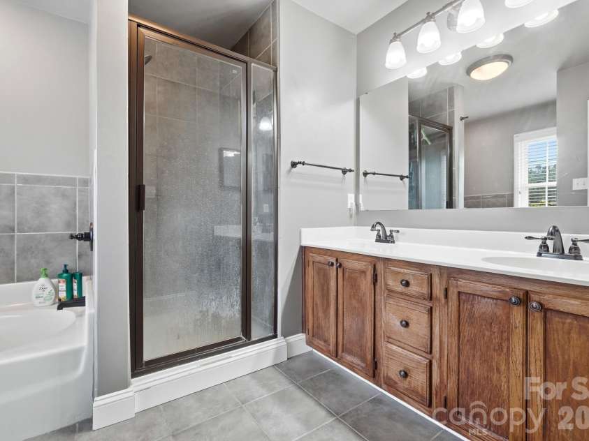 201 Wainsley Place, Matthews, NC 28105.  MLS# CAR4407896, YatesRealty ID 45535. Primary Bathroom w/Updated Tile, Separate Shower/Garden Tub Combo, Double Sinks