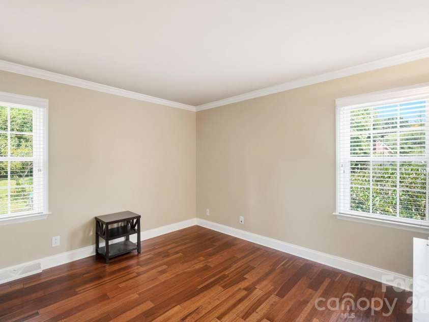 201 Wainsley Place, Matthews, NC 28105.  MLS# CAR4407896, YatesRealty ID 45535. Second Bedroom w/Engineered Hardwood Floors, Crown Molding