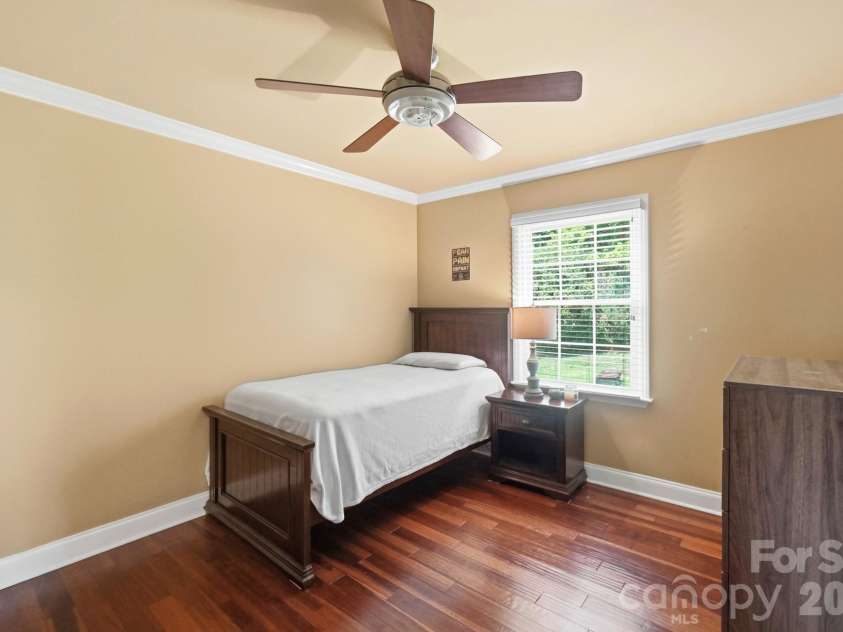 201 Wainsley Place, Matthews, NC 28105.  MLS# CAR4407896, YatesRealty ID 45535. Third Bedroom w/Engineered Hardwood Floors, Crown Molding