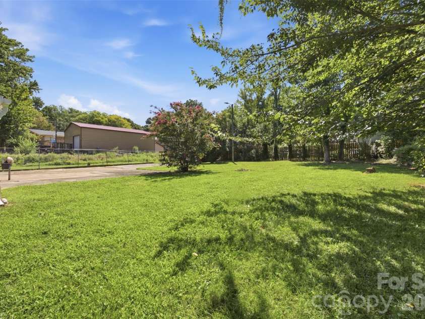 5218 Dolphin Lane, Charlotte, NC 28215.  MLS# CAR4415412, YatesRealty ID 45538. Backyard