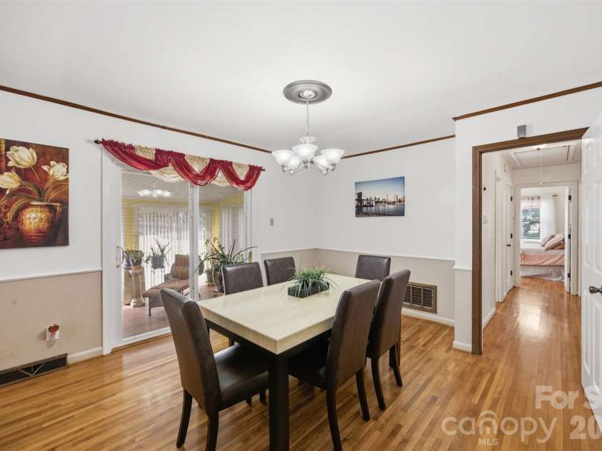 5218 Dolphin Lane, Charlotte, NC 28215.  MLS# CAR4415412, YatesRealty ID 45538. Dining room overlooking the sunroom