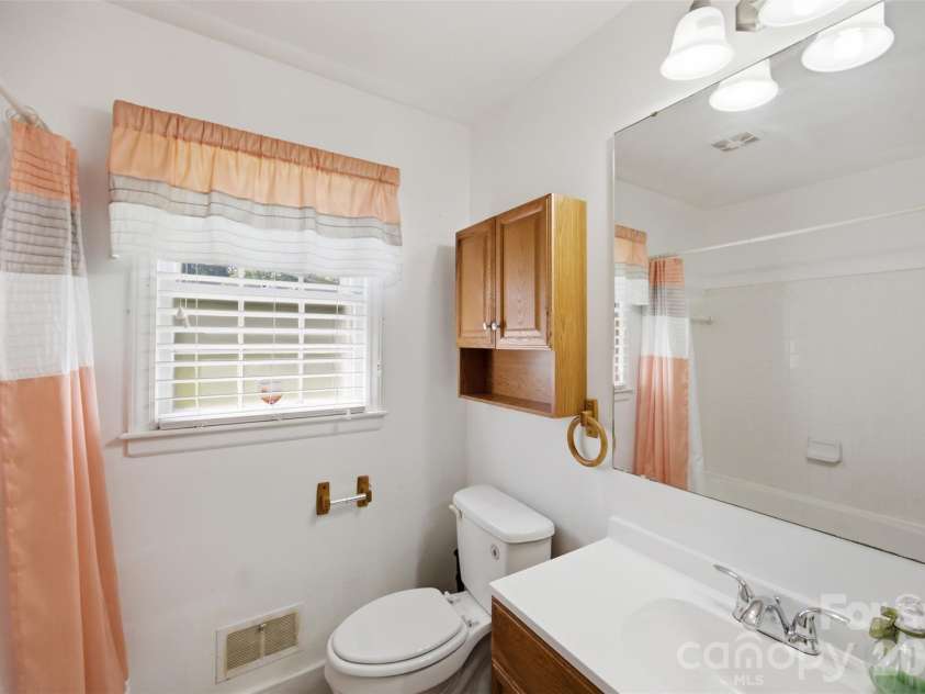 5218 Dolphin Lane, Charlotte, NC 28215.  MLS# CAR4415412, YatesRealty ID 45538. Guest bathroom