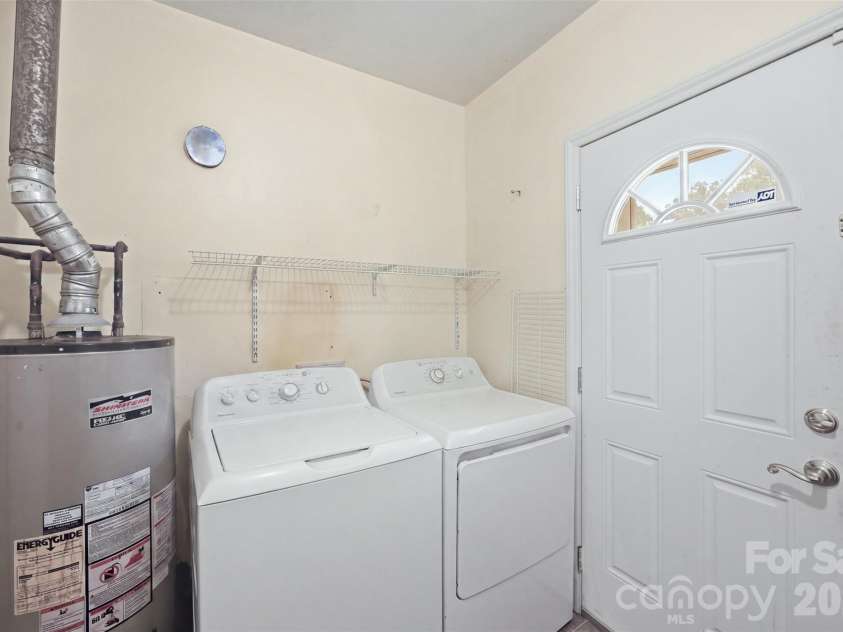 5218 Dolphin Lane, Charlotte, NC 28215.  MLS# CAR4415412, YatesRealty ID 45538. Laundry room, located off the kitchen