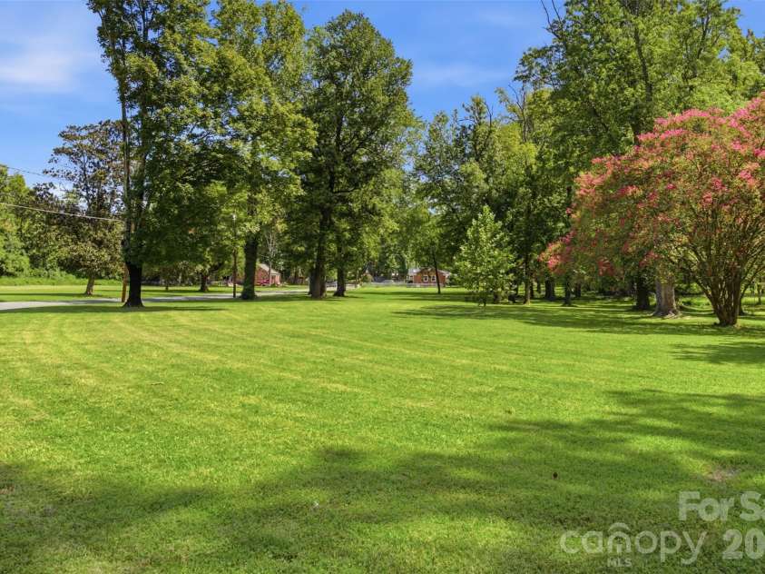 5218 Dolphin Lane, Charlotte, NC 28215.  MLS# CAR4415412, YatesRealty ID 45538. Open area next door
