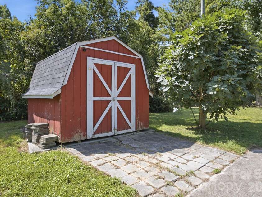 5218 Dolphin Lane, Charlotte, NC 28215.  MLS# CAR4415412, YatesRealty ID 45538. Storage shed