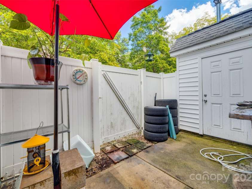 140 Reid Lane, Pineville, NC 28134.  MLS# CAR4227659, YatesRealty ID 4555. Private, fenced patio with storage room