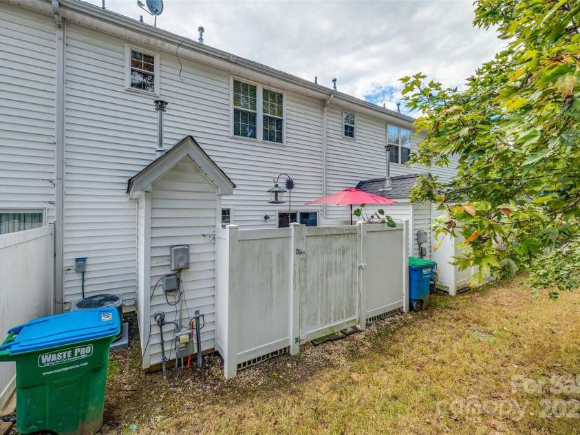 140 Reid Lane, Pineville, NC 28134.  MLS# CAR4227659, YatesRealty ID 4555. Rear of home with privacy fencing