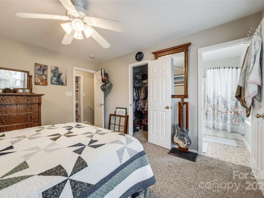 140 Reid Lane, Pineville, NC 28134.  MLS# CAR4227659, YatesRealty ID 4555. Spacious bedroom with walk-in closet and attached bathroom