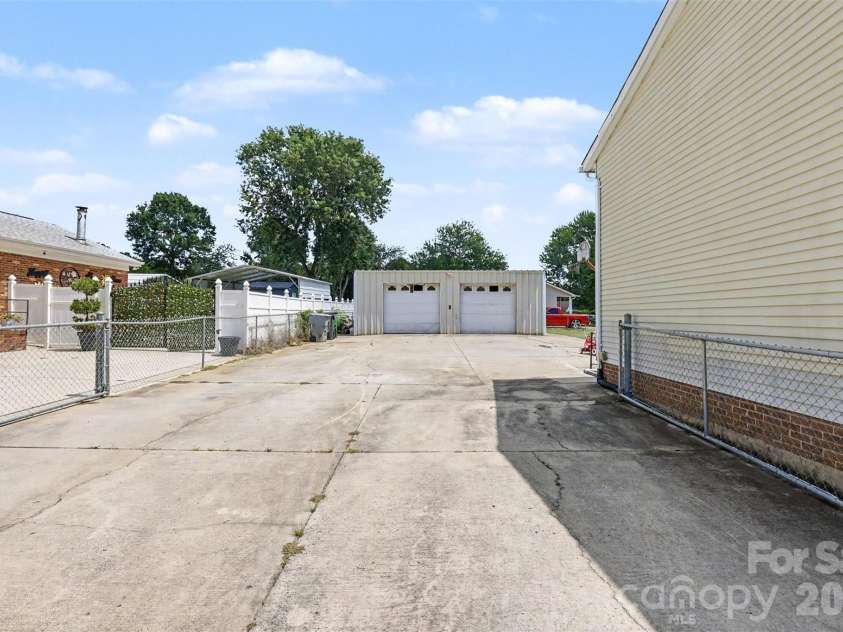 2119 O Hara Drive, Charlotte, NC 28273.  MLS# CAR4415100, YatesRealty ID 45557. Fence in back driveway for extra parking and security