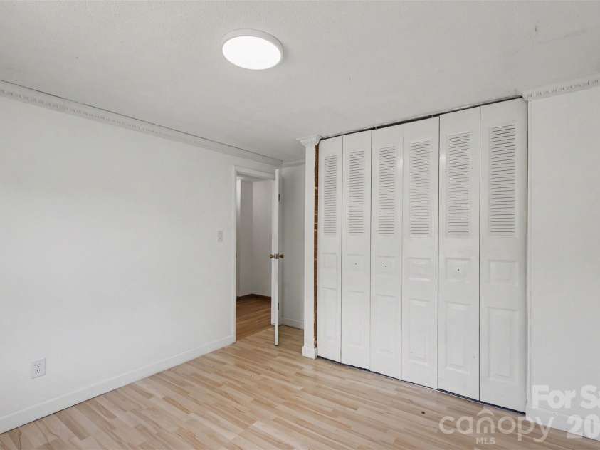 2119 O Hara Drive, Charlotte, NC 28273.  MLS# CAR4415100, YatesRealty ID 45557. Second bedroom with a large closet w/shelving