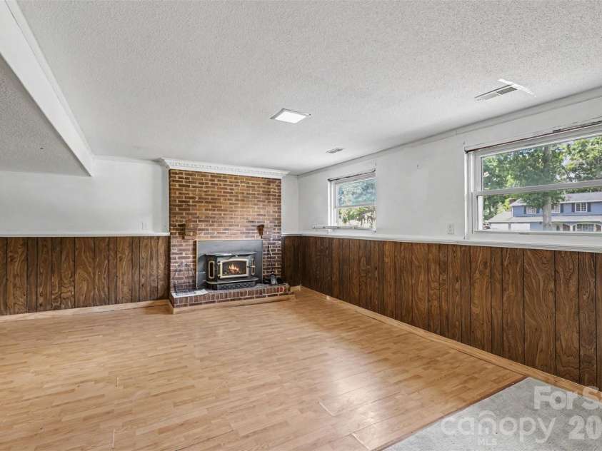2119 O Hara Drive, Charlotte, NC 28273.  MLS# CAR4415100, YatesRealty ID 45557. Spacious rec room with fireplace