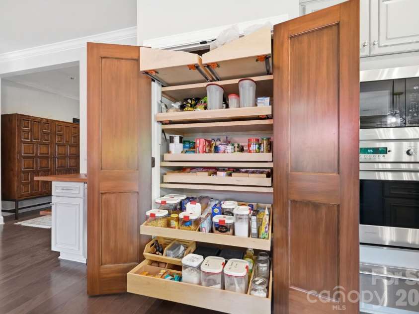 6127 Raven Rock Drive, Denver, NC 28037.  MLS# CAR4414430, YatesRealty ID 45559. Now THIS is a pantry! Customized pull-out storage keeps everything organized and easily within reach.