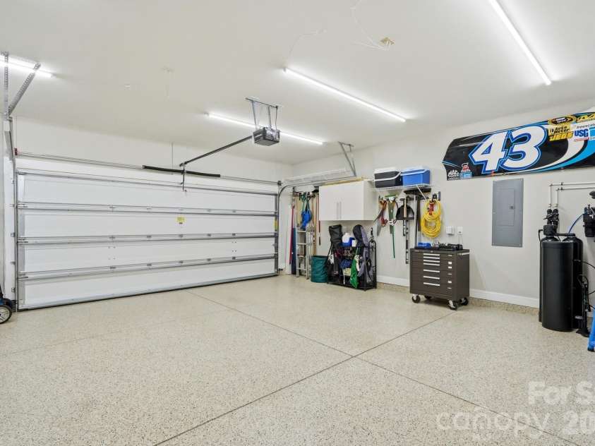 6127 Raven Rock Drive, Denver, NC 28037.  MLS# CAR4414430, YatesRealty ID 45559. The oversized garage offers exceptional usable space plus dedicated golf cart storage.