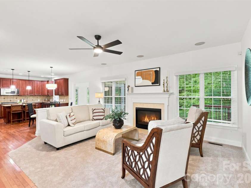 3013 Groves Edge Lane, Waxhaw, NC 28173.  MLS# CAR4403547, YatesRealty ID 45576. Inviting great room with fireplace and serene backyard views