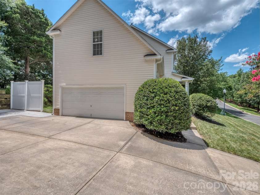 12657 Cardinal Woods Drive, Pineville, NC 28134.  MLS# CAR4411297, YatesRealty ID 45585. Side load garage