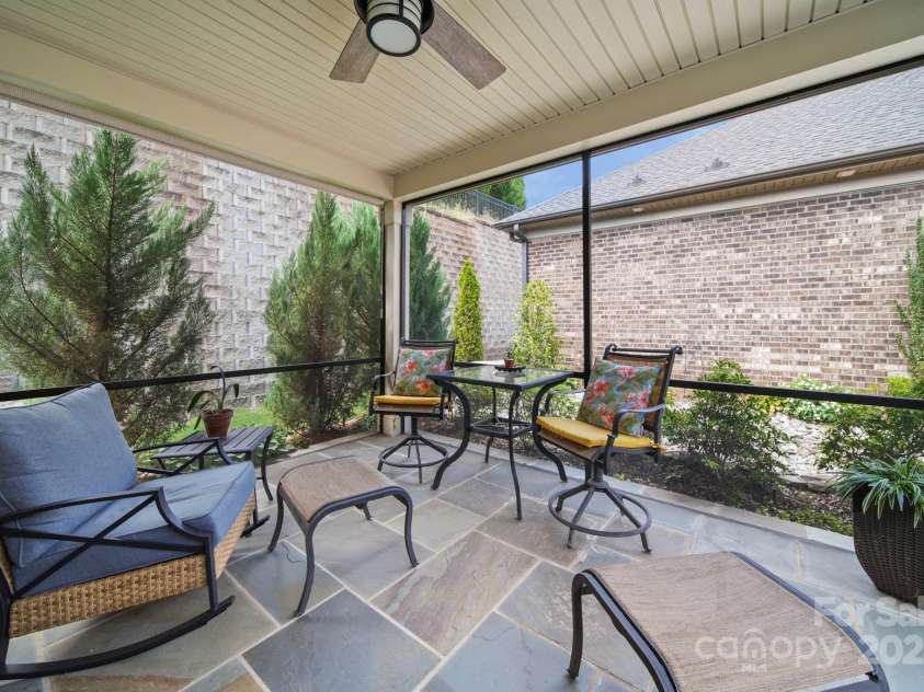 5256 Courtyard Lane, Belmont, NC 28012.  MLS# CAR4299282, YatesRealty ID 4561. Screened porch with slate tile