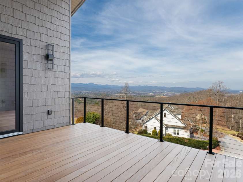 247 Coachman Drive, Hendersonville, NC 28791.  MLS# CAR4355348, YatesRealty ID 45621. Main Level Deck with majestic mountain views