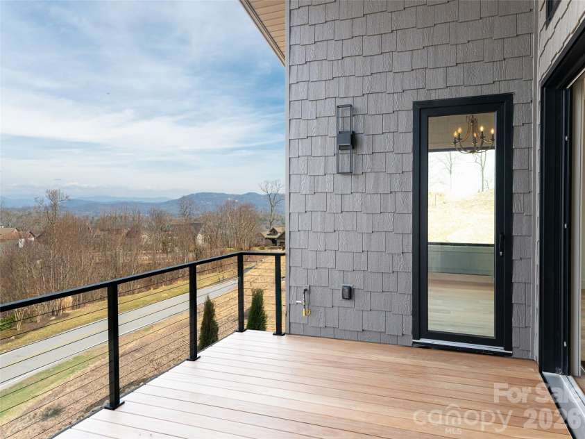 247 Coachman Drive, Hendersonville, NC 28791.  MLS# CAR4355348, YatesRealty ID 45621. Main Level Deck with majestic mountain views