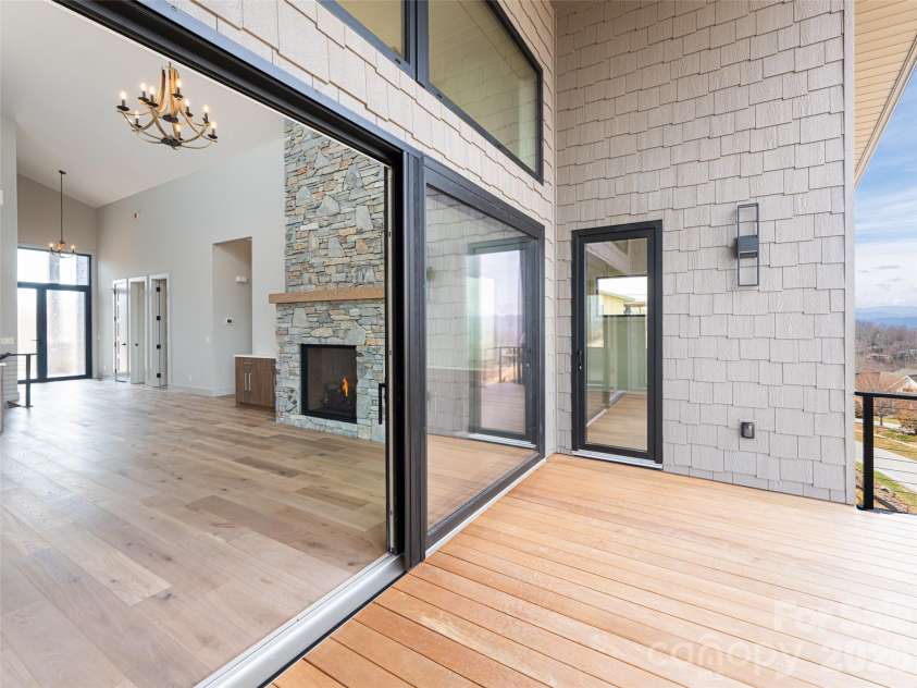 247 Coachman Drive, Hendersonville, NC 28791.  MLS# CAR4355348, YatesRealty ID 45621. Main Level Deck with Oknoplast Sliding Doors