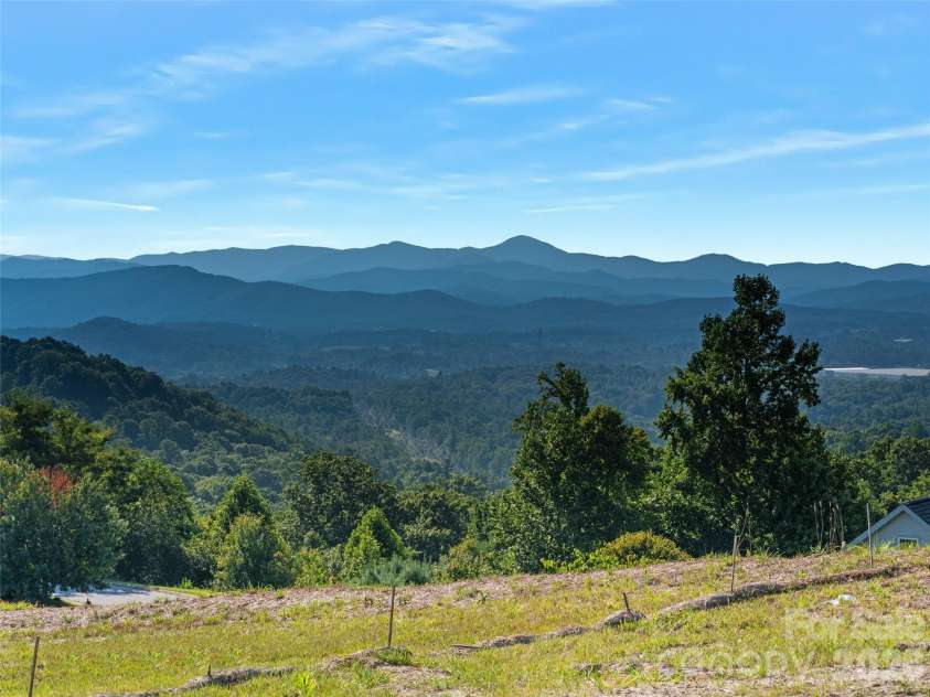 247 Coachman Drive, Hendersonville, NC 28791.  MLS# CAR4355348, YatesRealty ID 45621. Multi - layered, stunning long range Mountain Views