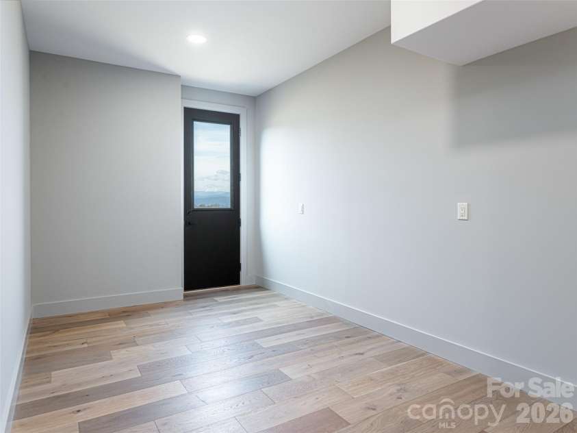247 Coachman Drive, Hendersonville, NC 28791.  MLS# CAR4355348, YatesRealty ID 45621. Utility Room with exterior entry/exit
