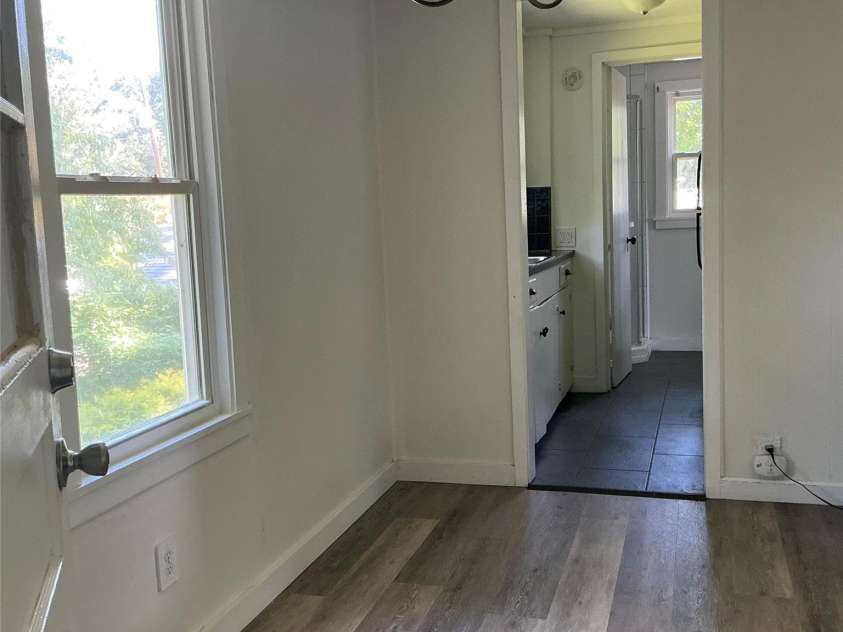 827 Forest Street, Hendersonville, NC 28739.  MLS# CAR4416484, YatesRealty ID 45624. Unit A main room toward kitchen