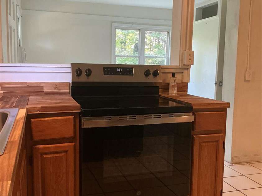 827 Forest Street, Hendersonville, NC 28739.  MLS# CAR4416484, YatesRealty ID 45624. Unit B kitchen overlooking main room