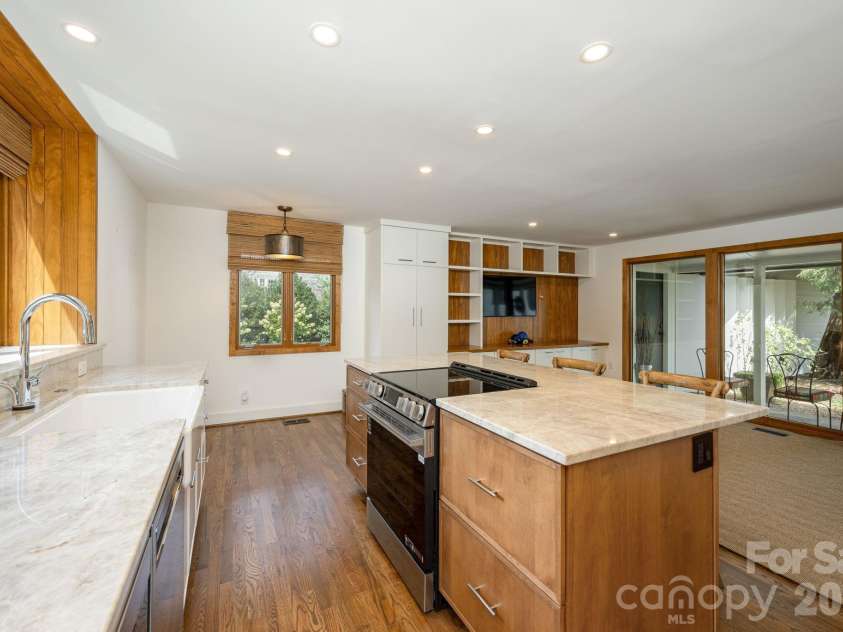 28 Forest Road, Asheville, NC 28803.  MLS# CAR4361641, YatesRealty ID 45647. Deep-drawer storage in the kitchen