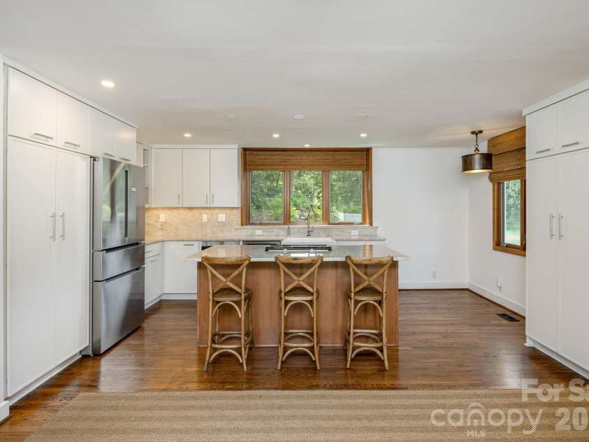 28 Forest Road, Asheville, NC 28803.  MLS# CAR4361641, YatesRealty ID 45647. Kitchen with breakfast area by windows