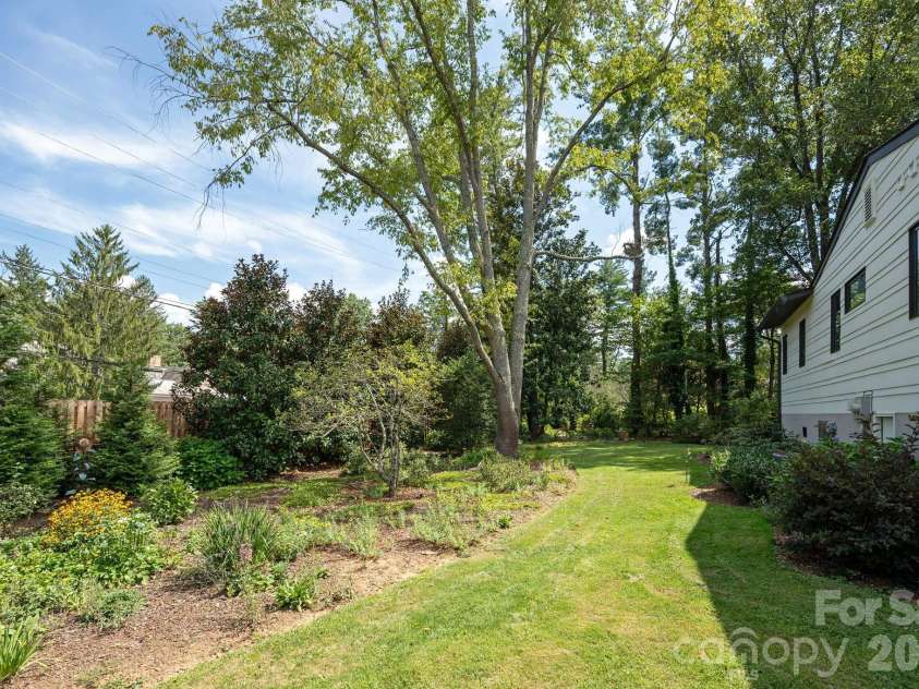 28 Forest Road, Asheville, NC 28803.  MLS# CAR4361641, YatesRealty ID 45647. Large flower beds