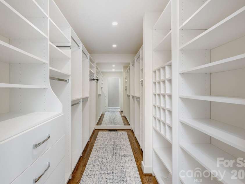 28 Forest Road, Asheville, NC 28803.  MLS# CAR4361641, YatesRealty ID 45647. Primary closet with built-ins