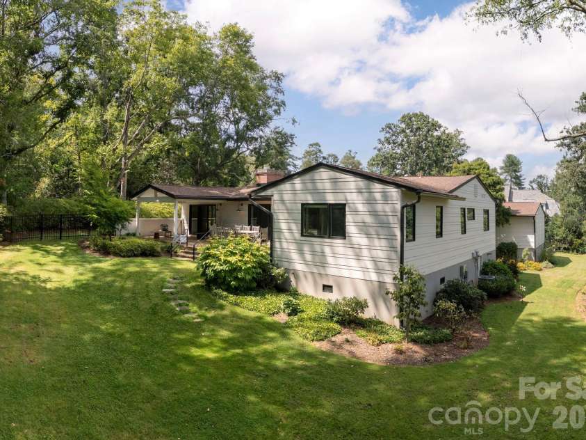 28 Forest Road, Asheville, NC 28803.  MLS# CAR4361641, YatesRealty ID 45647. Rear with small basement and large crawl space