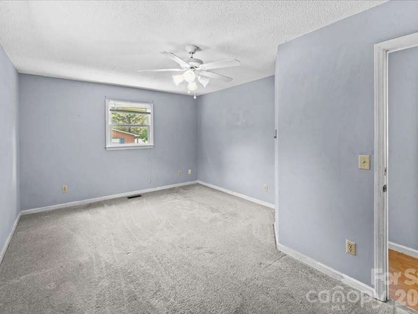 517 Elm Street, Locust, NC 28097.  MLS# CAR4416638, YatesRealty ID 45693. Master bedroom