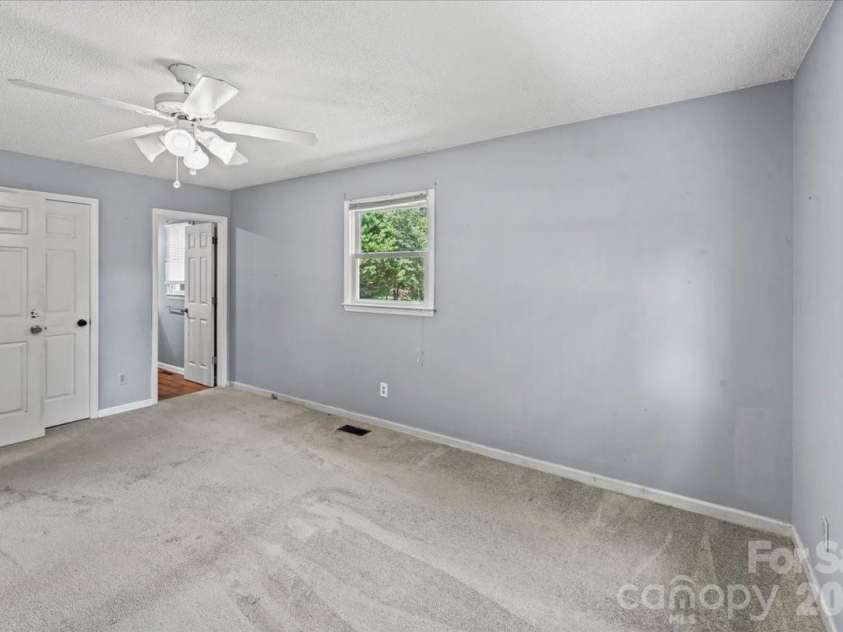 517 Elm Street, Locust, NC 28097.  MLS# CAR4416638, YatesRealty ID 45693. Master bedroom