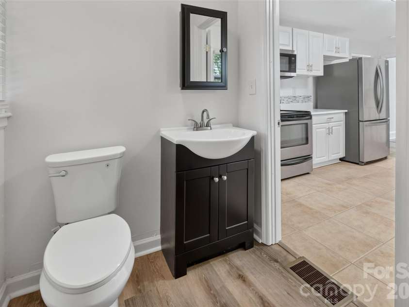 1062 Dresden Drive, Charlotte, NC 28205.  MLS# CAR4412052, YatesRealty ID 45694. Half Bath off Kitchen